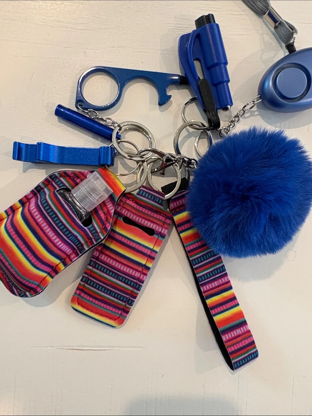 Women’s Blue Pom Pom Keychain Set with Safety Alarm & Sanitizer Holder